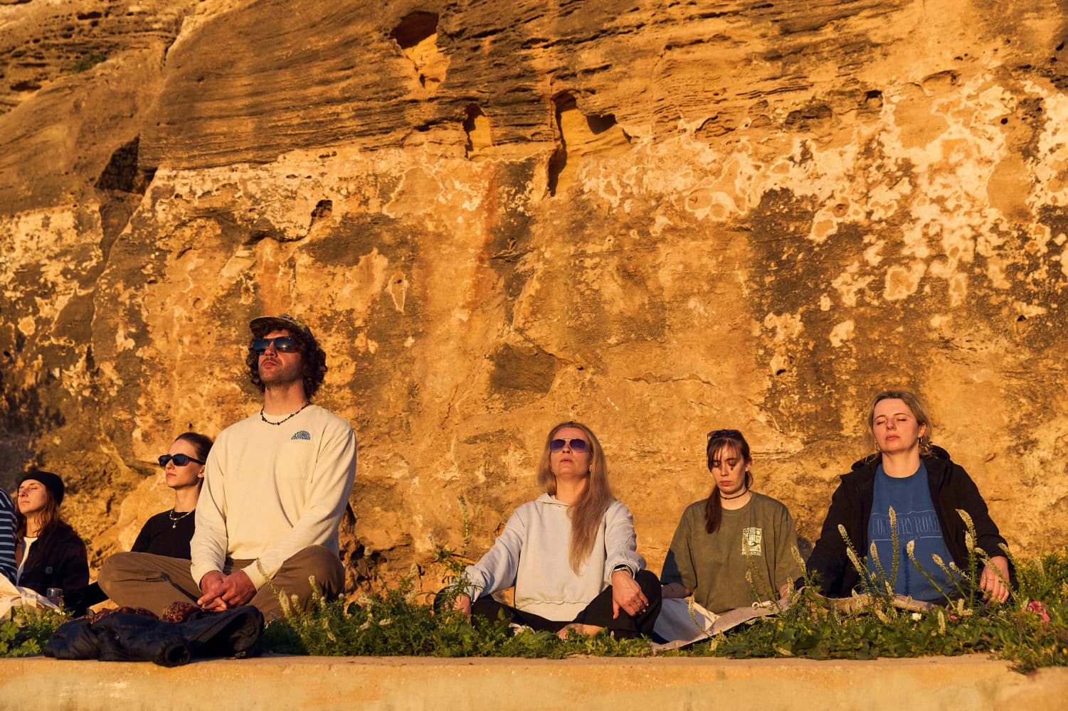 Cliffside group meditation at Aman Surf & Yoga in Imsouane, Morocco