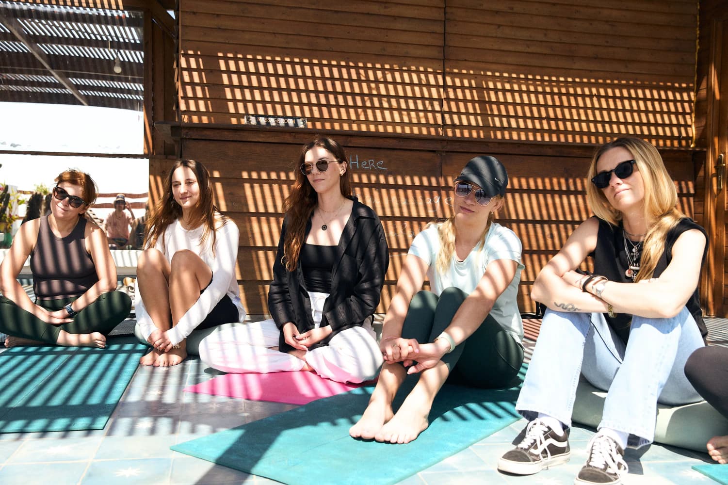 Friends resting after yoga class at Aman Surf & Yoga in Imsouane, Morocco