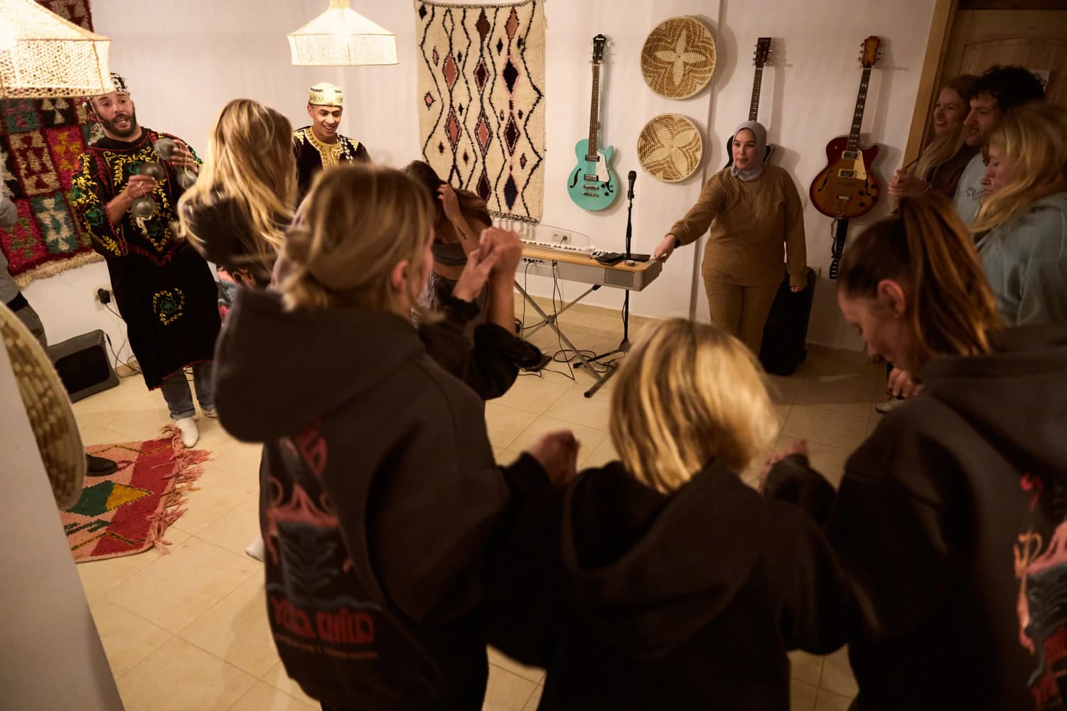 Guests dancing to live music at Aman Surf & Yoga in Imsouane, Morocco