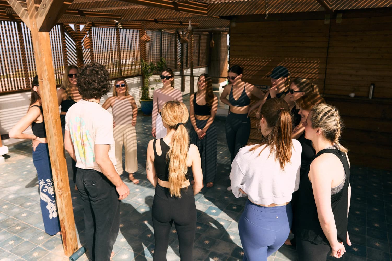 Rooftop group circle activity at Aman Surf & Yoga in Imsouane, Morocco