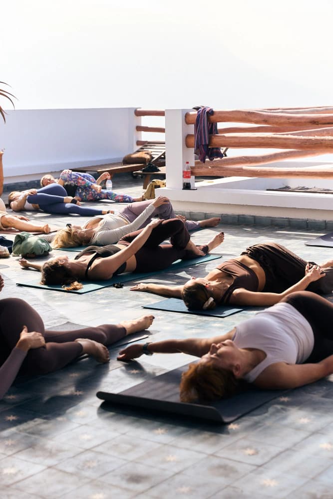 Rooftop savasana relaxation at Aman Surf & Yoga in Imsouane, Morocco
