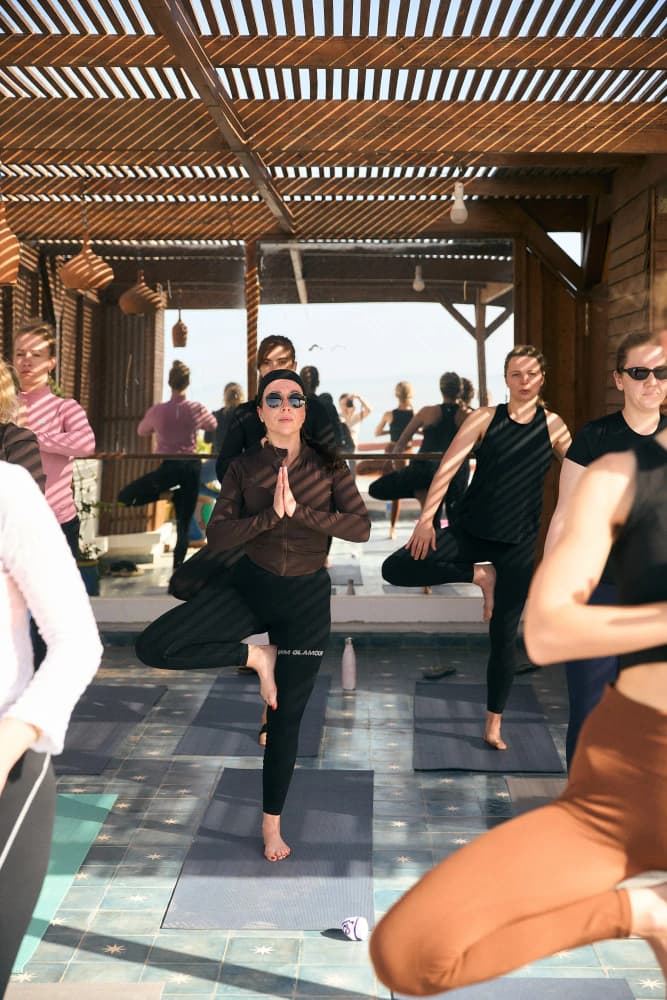 Rooftop yoga flow session at Aman Surf & Yoga in Imsouane, Morocco