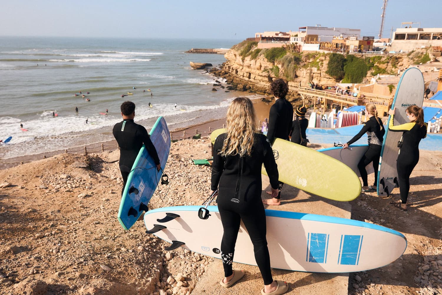 Surfers overlooking break before session at Aman Surf & Yoga in Imsouane, Morocco
